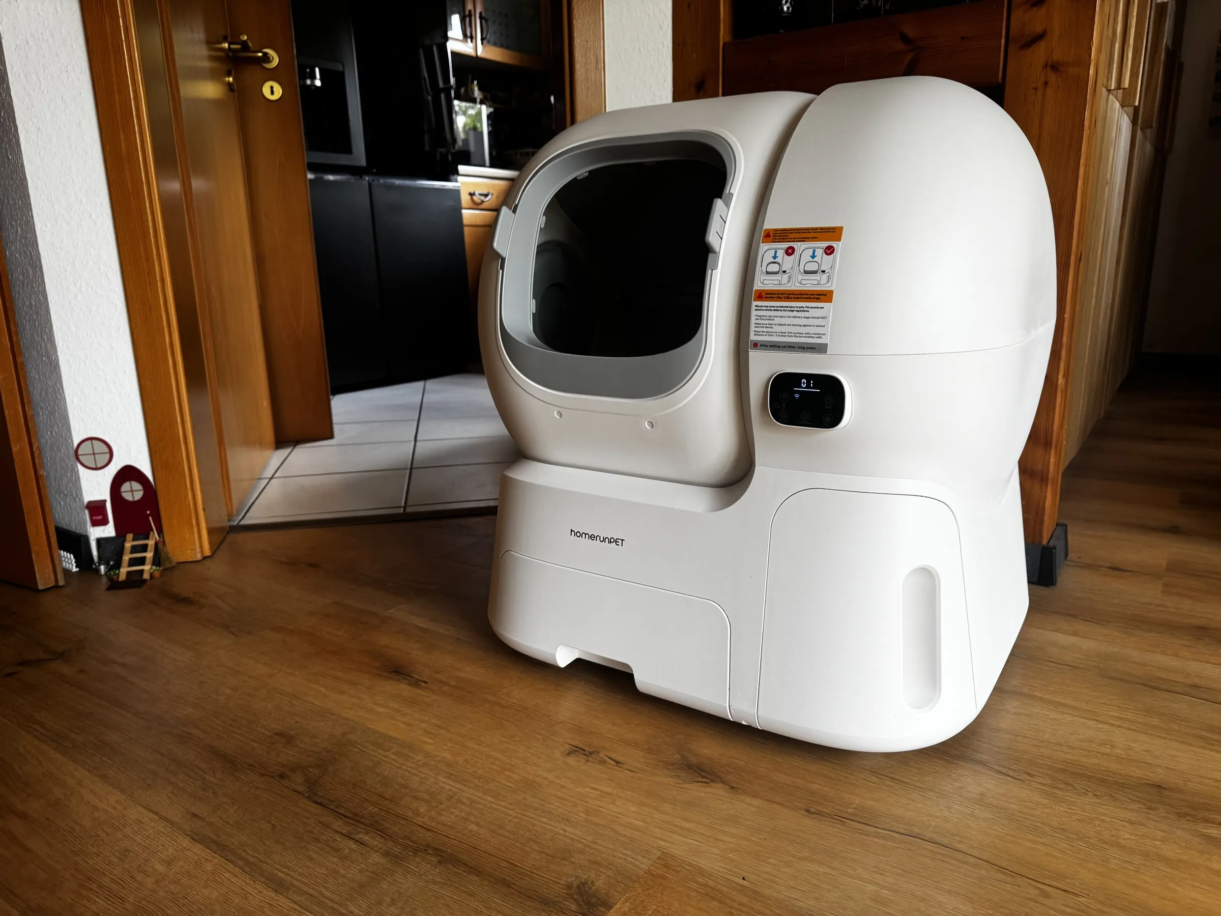 homerunPET CS106 placed in a home hallway, showing the floor space and clearance needed around the device